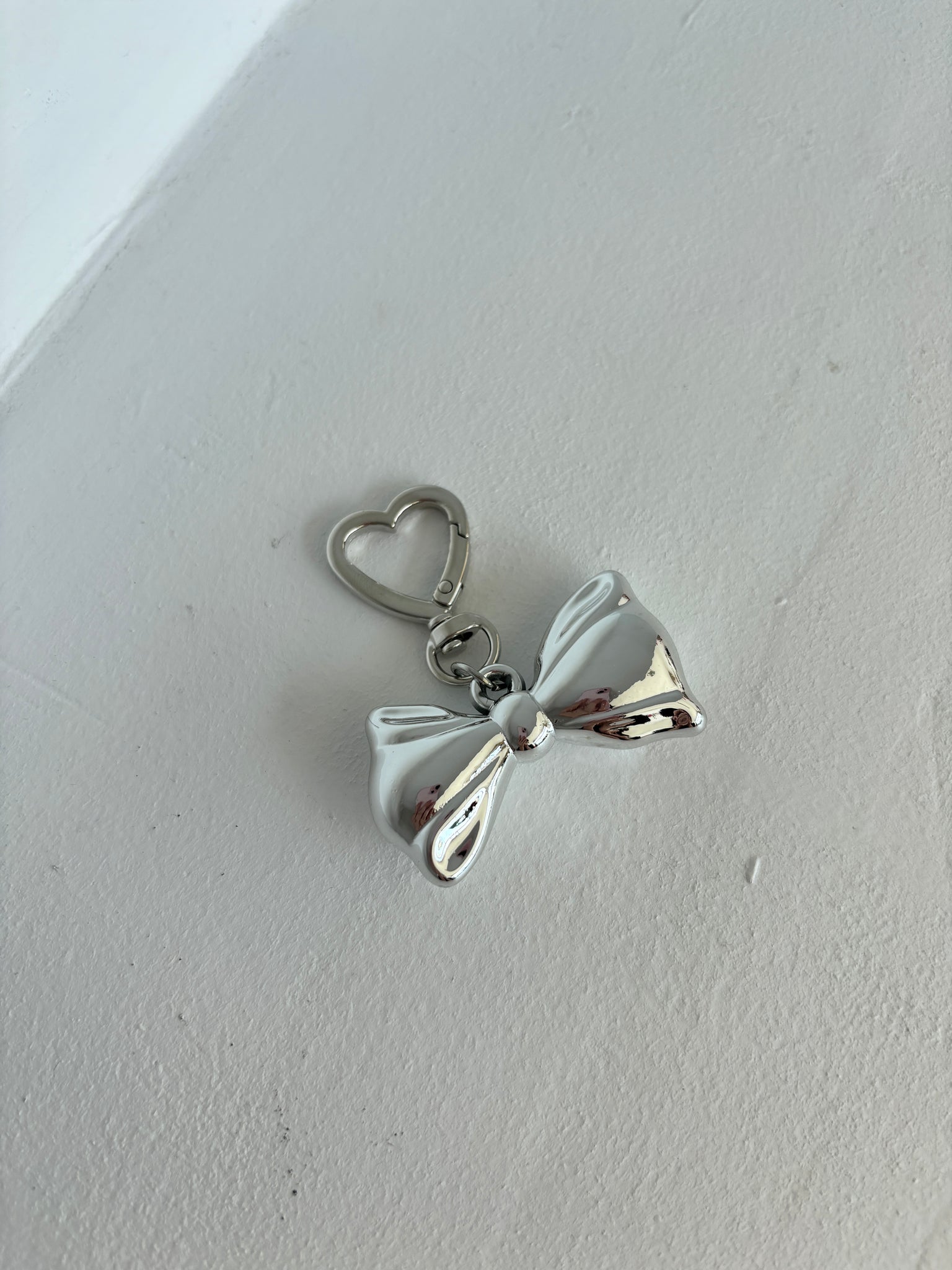 SILVER BOW BAG CHARM
