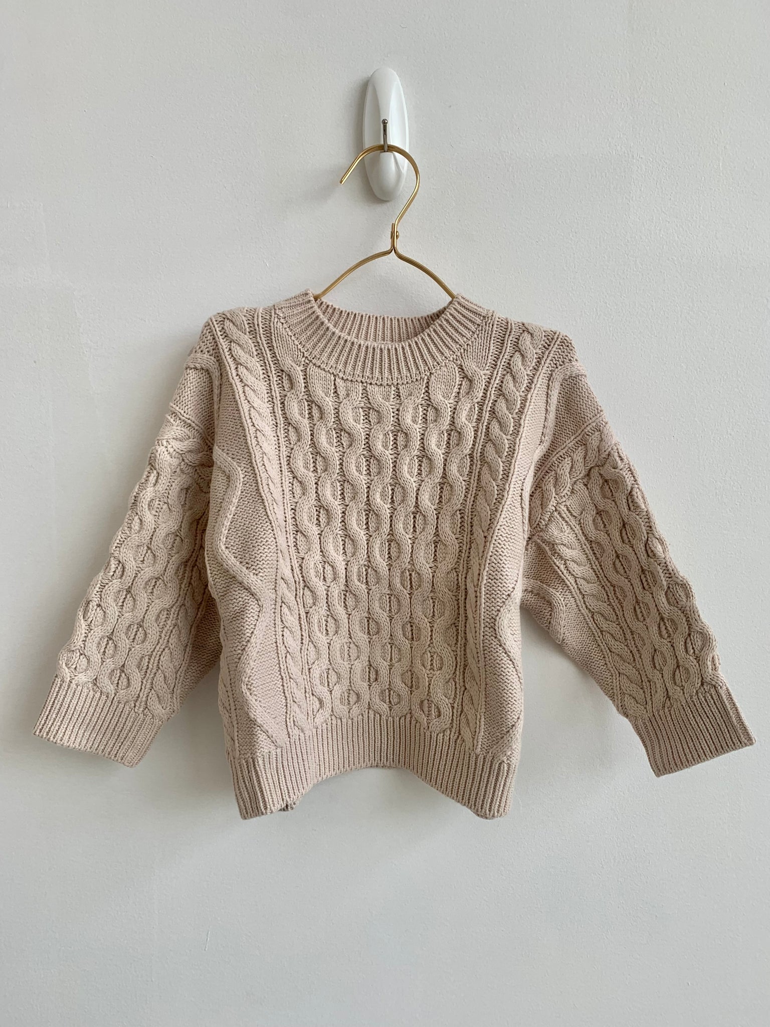 BUNDLED UP IN BEIGE SWEATER