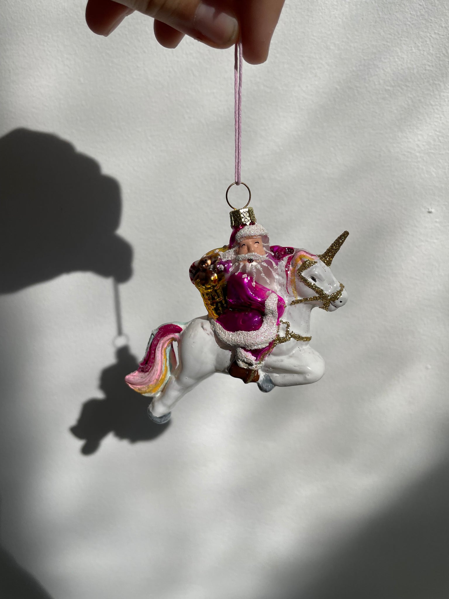 SANTA ON A UNICORN ORNAMENT